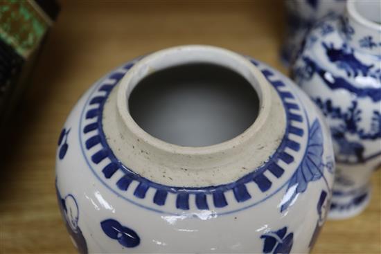 A 19th century Chinese blue and white ovoid jar, wood cover and two similar smaller vases tallest 15cm